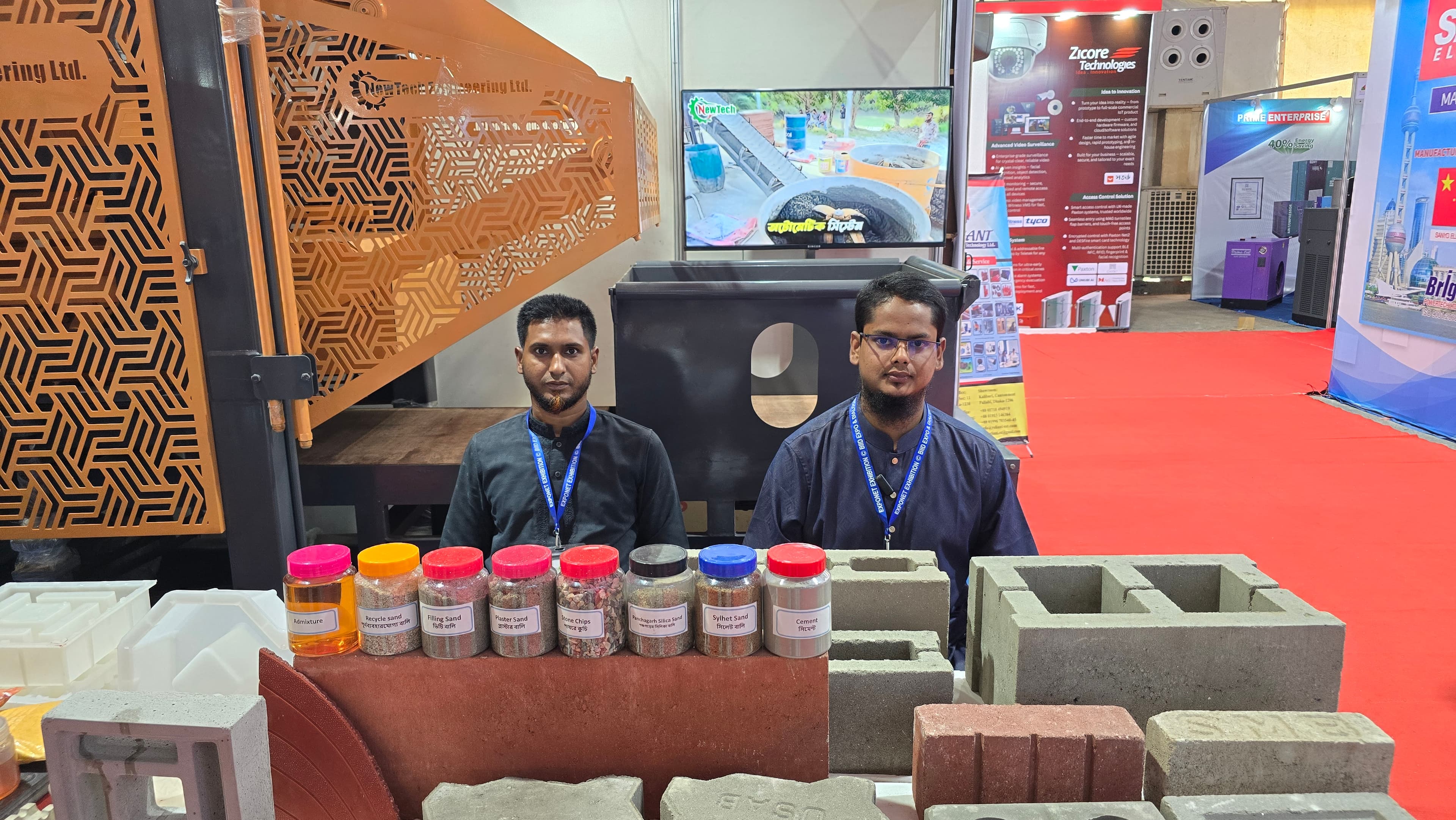 NewTech team presenting concrete block and paver samples at the expo